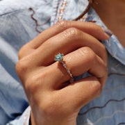 Round Solitaire Engagement Ring With Twisted Setting