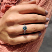 Cyan Blue Round Cut Engagement Ring With Twisted Pave