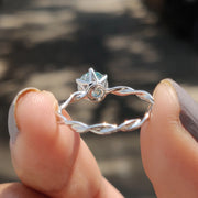 Round Solitaire Engagement Ring With Twisted Setting